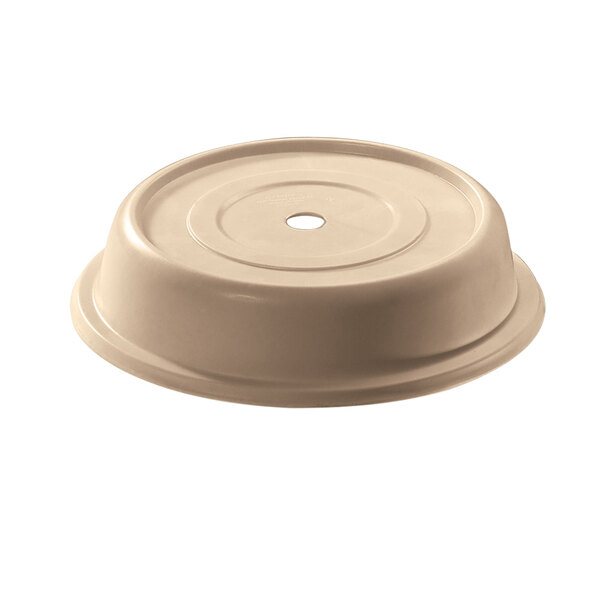 A beige plastic Cambro plate cover with a hole in it.