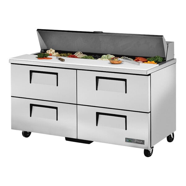 A True stainless steel refrigerated sandwich prep table with drawers.