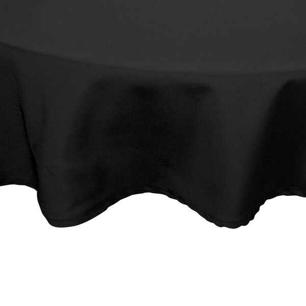 A black Intedge round tablecloth with a hemmed border.