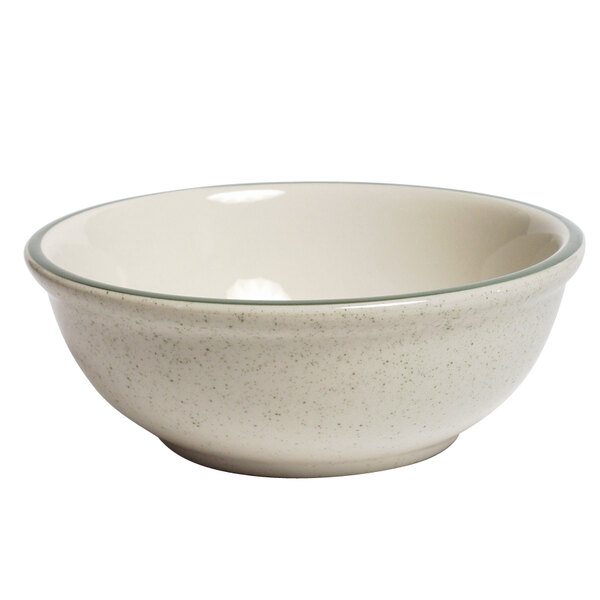A white bowl with a speckled green rim.
