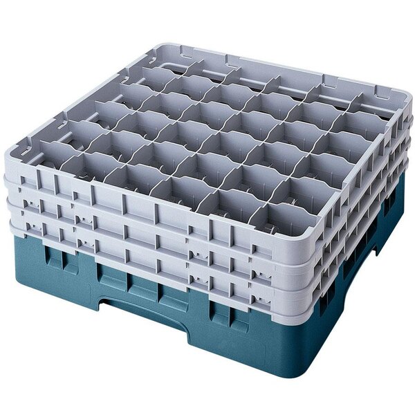 A teal plastic Cambro glass rack with 36 compartments and 6 extenders.