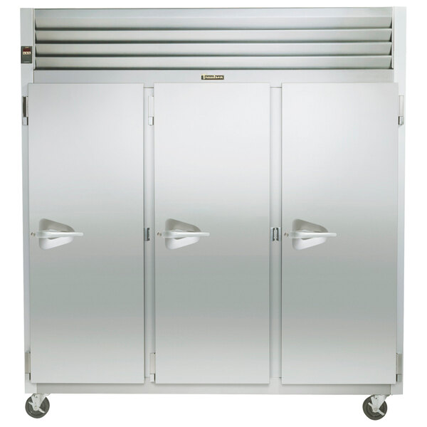 A large white Traulsen G Series reach-in freezer with three white doors and handles.
