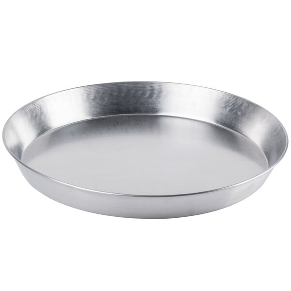 A silver Royal Industries aluminum deep dish pizza pan.
