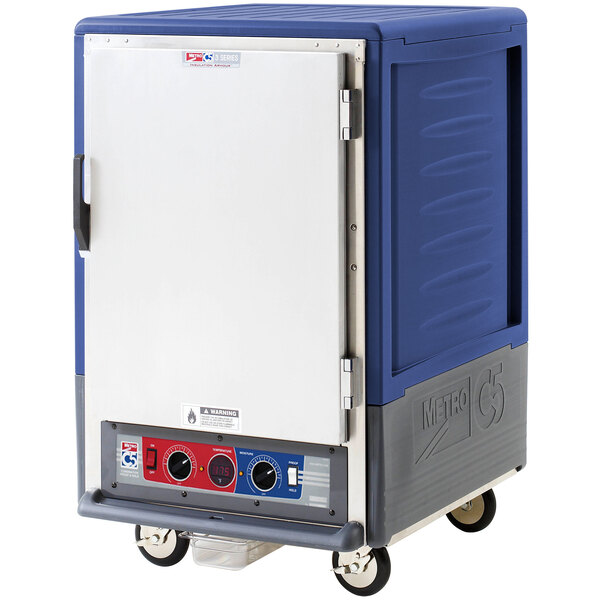 A blue Metro C5 heated holding and proofing cabinet with silver accents and wheels.