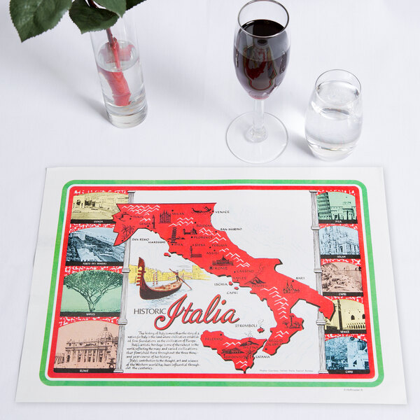 A Hoffmaster Historic Italia paper placemat on a table with glasses of wine and a map of Italy.