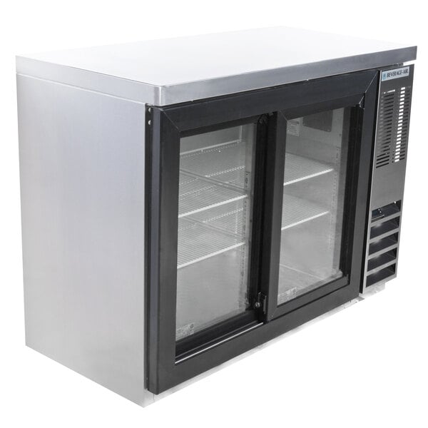 A Beverage-Air stainless steel counter height back bar refrigerator with sliding glass doors.