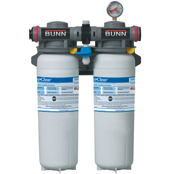 A Bunn water filtration system with two white containers with blue labels.