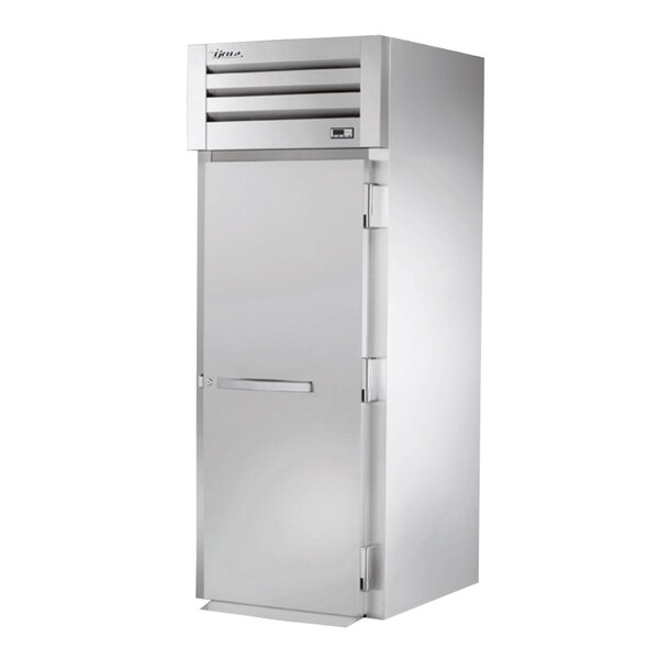 A white True Spec Series roll-in holding cabinet with a solid door.