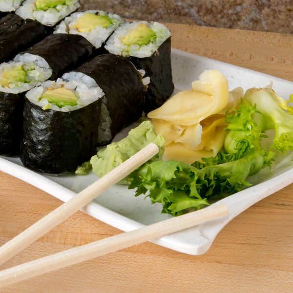 A plate of sushi with chopsticks on a Thunder Group Blue Bamboo melamine wave plate.