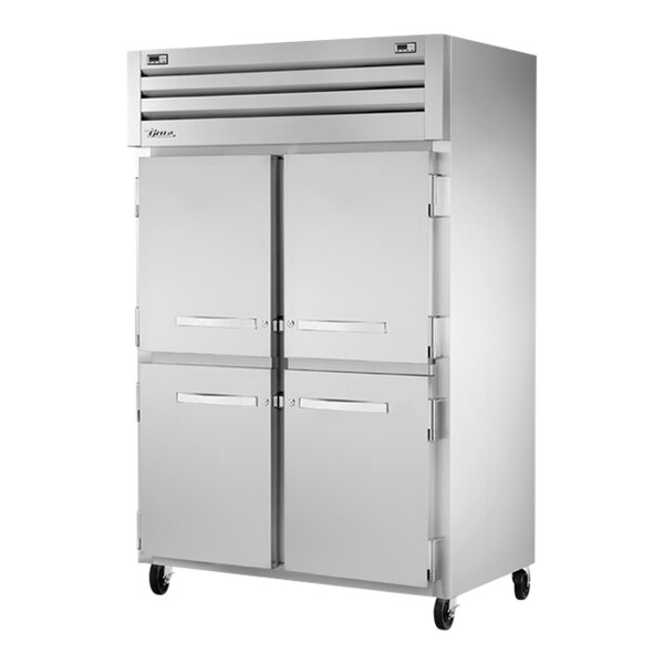 A white True Spec Series refrigerator with silver half doors.