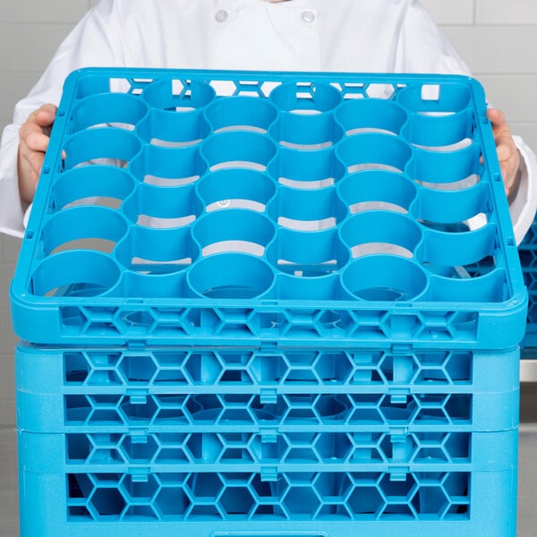 A man holding a blue plastic rack extender.