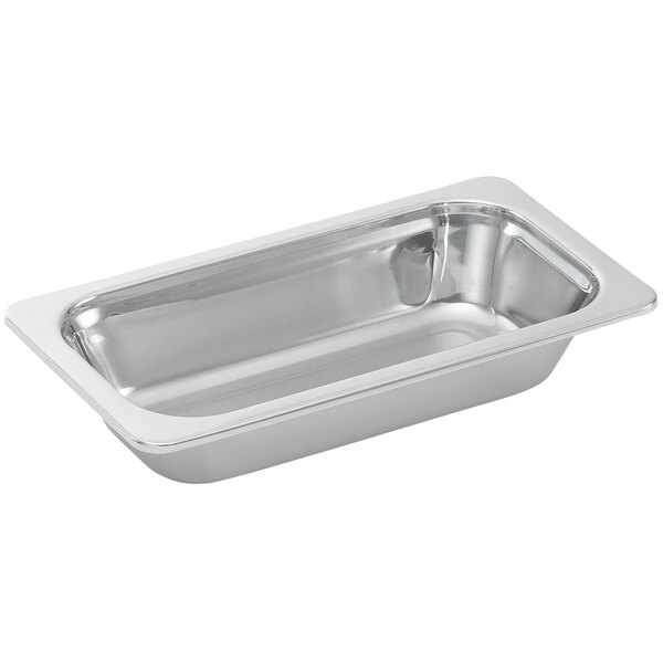 A Vollrath 1/3 size stainless steel steam table food pan with a mirror finish on a silver tray.