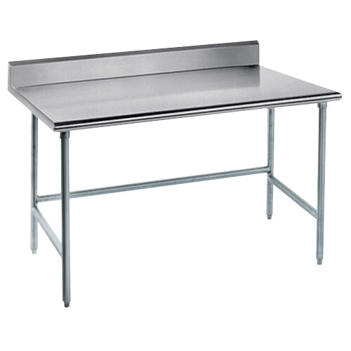 A metal stainless steel work table with a long rectangular top.
