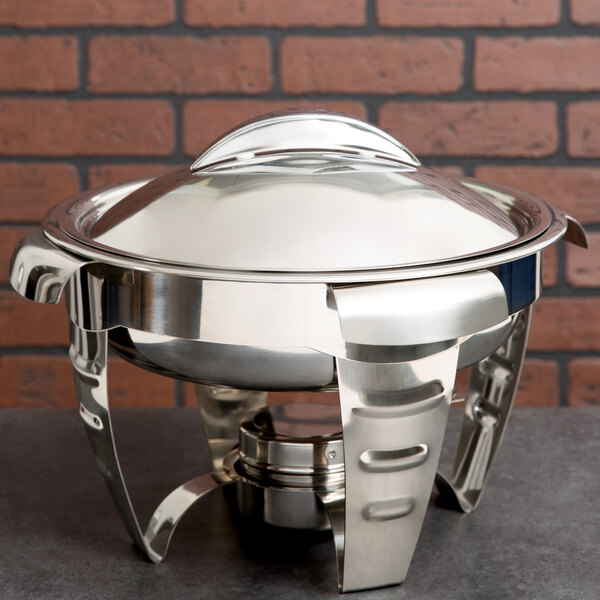 A Vollrath Maximillian stainless steel round chafer with a lid.