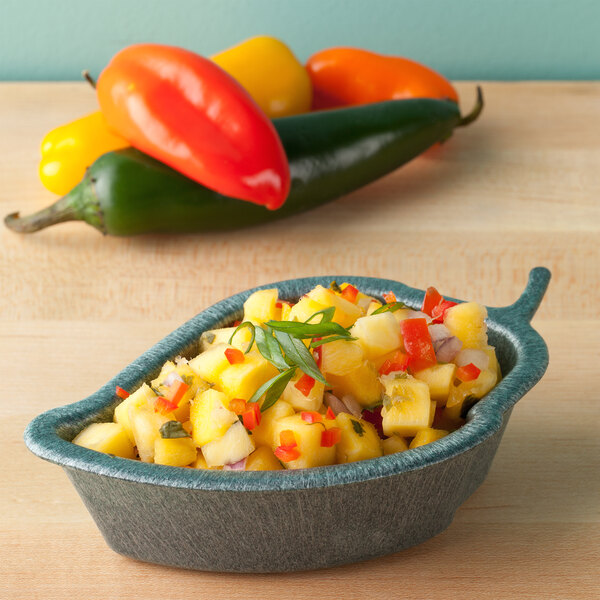 A bowl of pineapple jalapeno salsa on a counter.