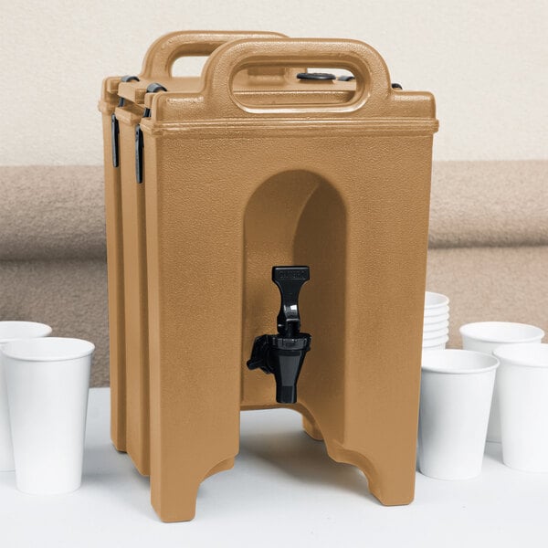 A brown Cambro insulated beverage dispenser with a black spigot.