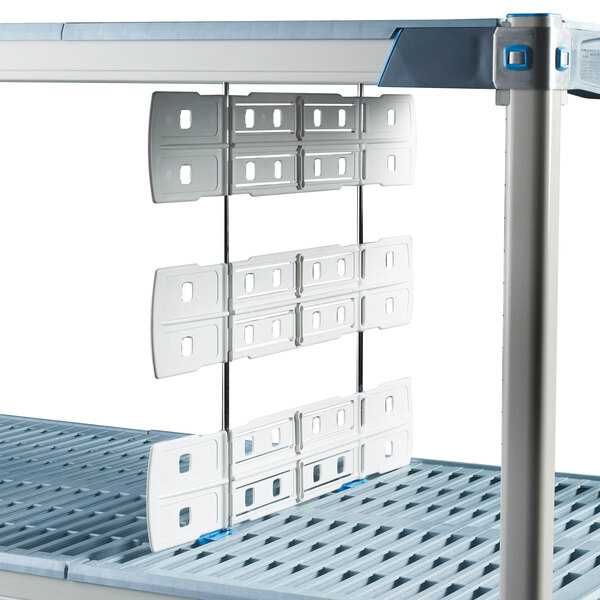 A white rectangular Metro shelf divider with two metal brackets on it.