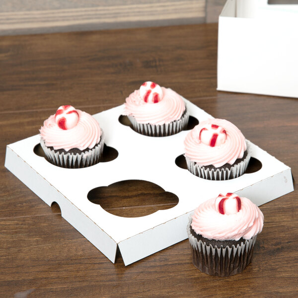 A Baker's Mark standard cupcake insert holding 4 cupcakes in a white box.