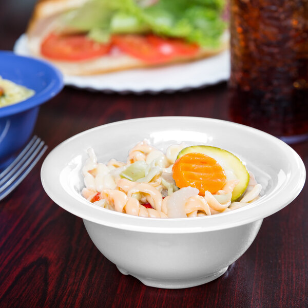 A diamond white melamine bowl with food in it.