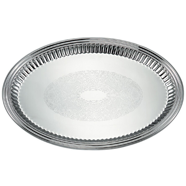 A silver oval stainless steel tray with a fluted design.