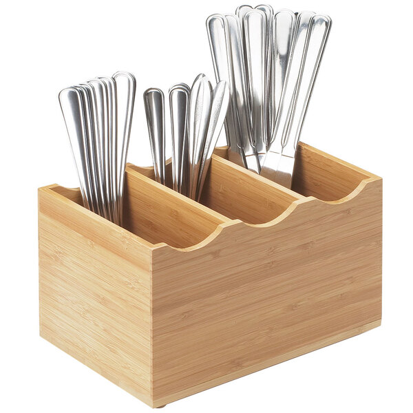 A Cal-Mil bamboo flatware organizer with spoons and forks in it.