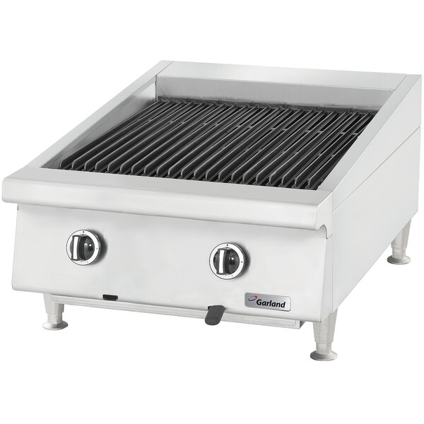 A Garland natural gas ceramic briquette charbroiler on a counter.
