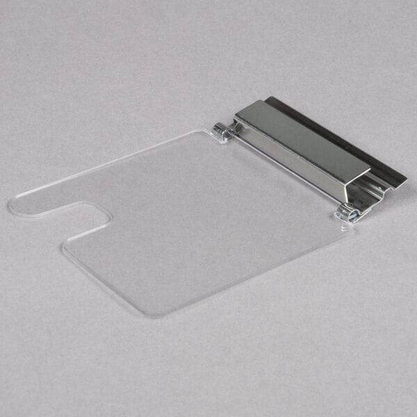 A clear plastic lid with a stainless steel hinge.