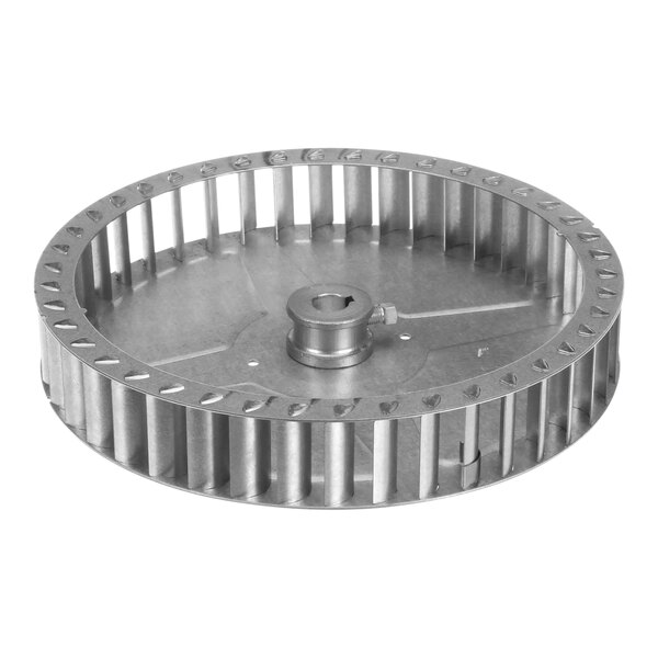 A metal blower wheel with a hole in the center.