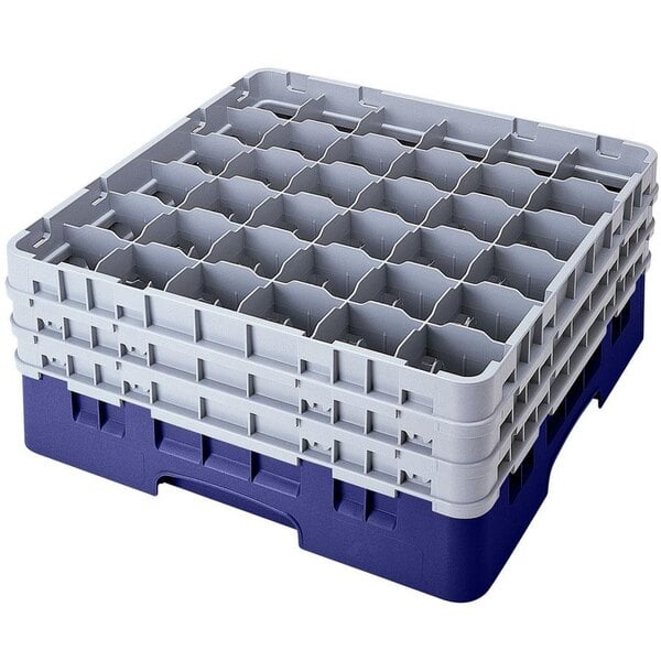 A navy blue plastic Cambro glass rack with 36 compartments and 6 extenders.