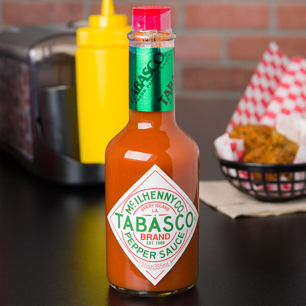 A bottle of TABASCO Original Hot Sauce on a table in a Mexican restaurant.