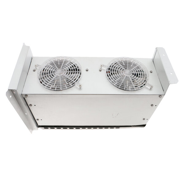 A white metal Delfield freezer coil assembly with two fans on top.