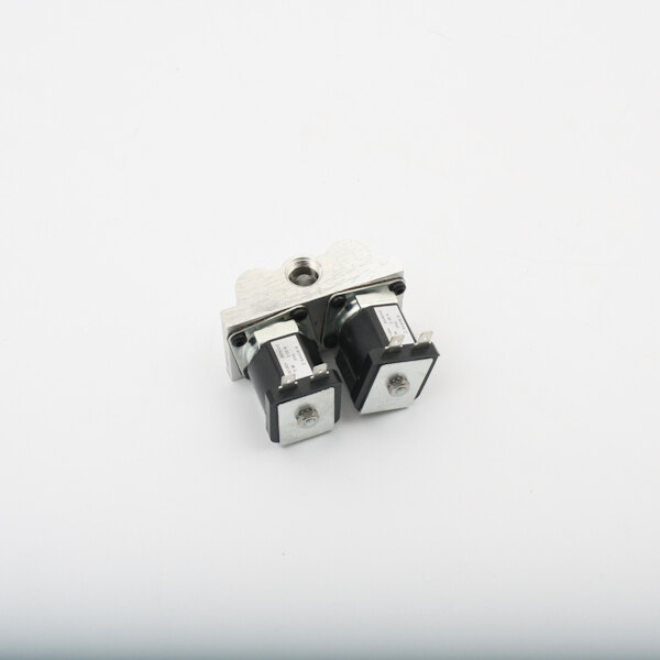 A close-up of the black and silver Vulcan Solenoid with metal connectors.