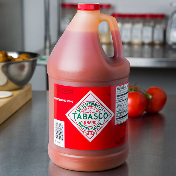 A gallon jug of TABASCO® Original Hot Sauce on a counter.