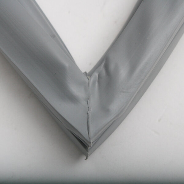 A close up of a grey plastic Duke Door Gasket.