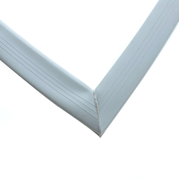 A close up of a corner of a white plastic Norlake refrigerator door gasket.