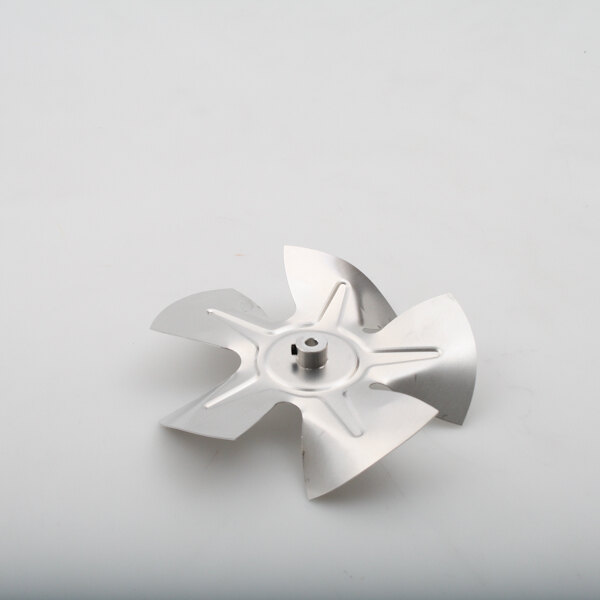 A metal fan blade for a Delfield 2162683 on a white surface.