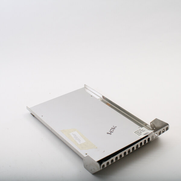 A white rectangular metal crumb tray with a white label.