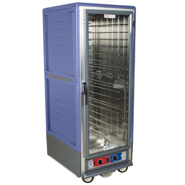 A large blue Metro C5 holding and proofing cabinet with shelves and a clear door.