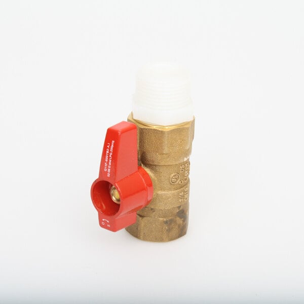A close-up of a brass Vollrath drain valve with a red handle.