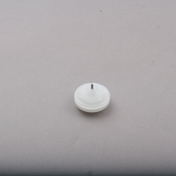 A white round Power Soak water sensor with a metal tip.