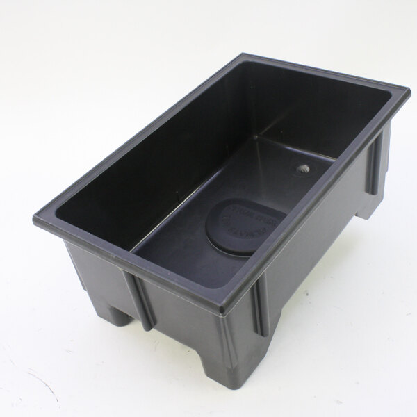 A black rectangular container with a hole in it.