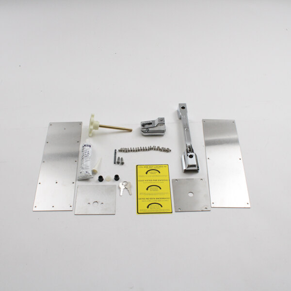 A Norlake latch kit with lock and key components on a white surface.
