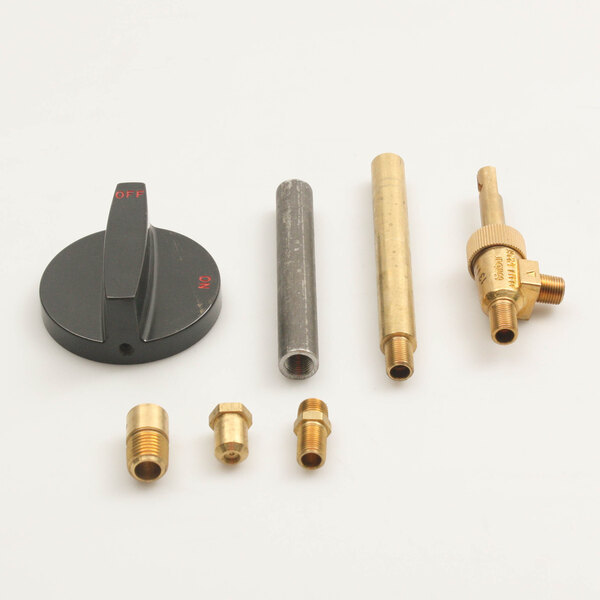 A group of brass Southbend gas valve parts.