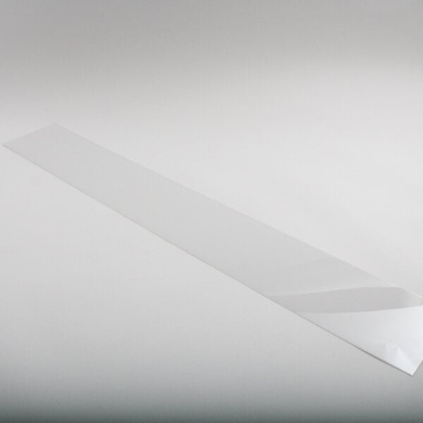 A white rectangular flat cover with a few lines on it.