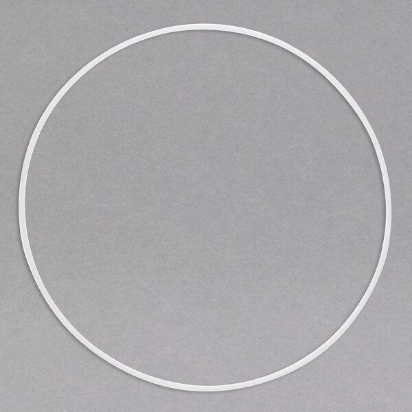 A white circle with a hole in it on a grey background.