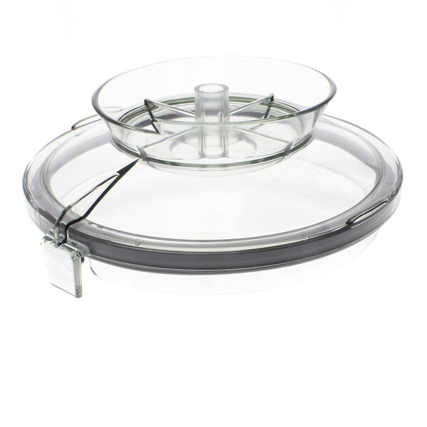 A clear plastic lid with a metal ring on top.