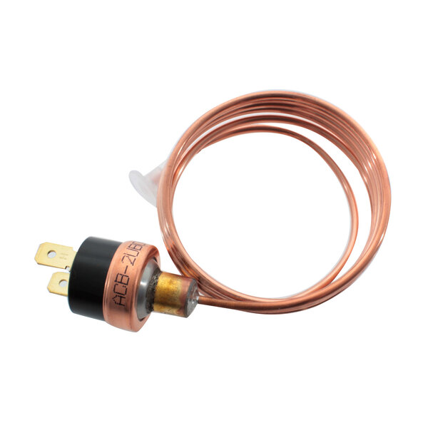 A copper wire connected to a black round copper and brass device.