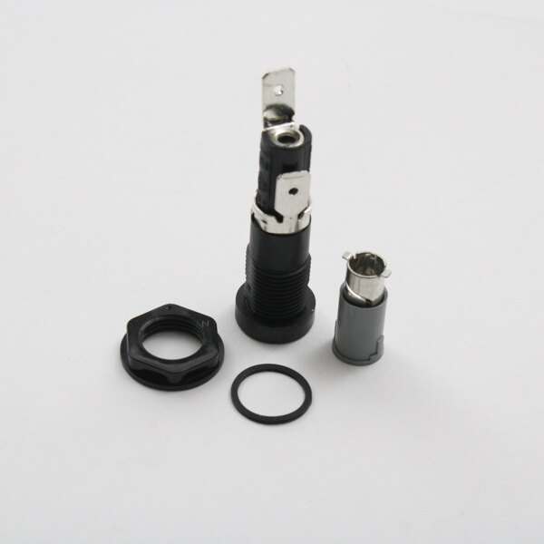 A black and silver Marshall Air fuse holder with a metal ring.