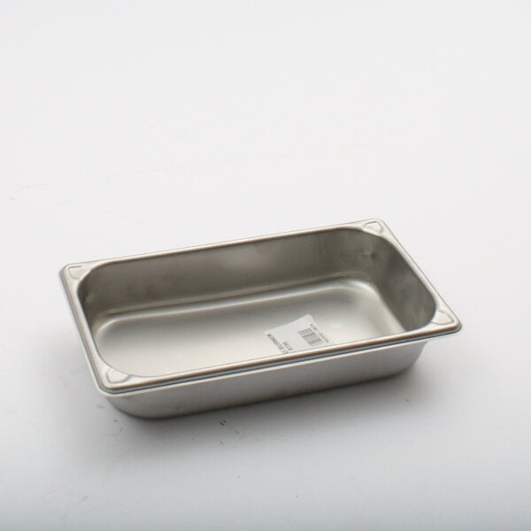 A silver rectangular NU-VU humidity pan with a white label.