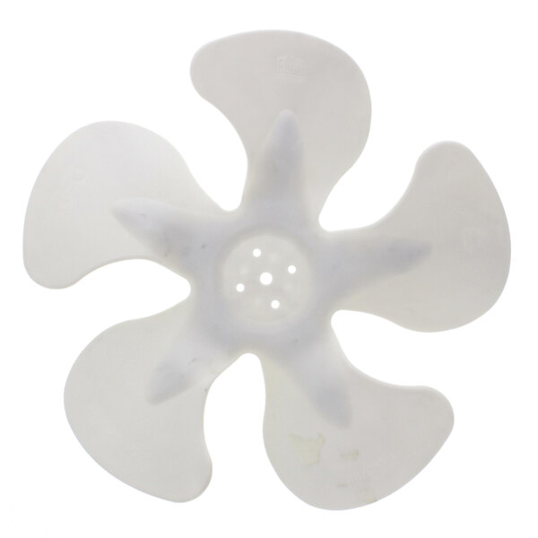 A white plastic fan blade with many dots.